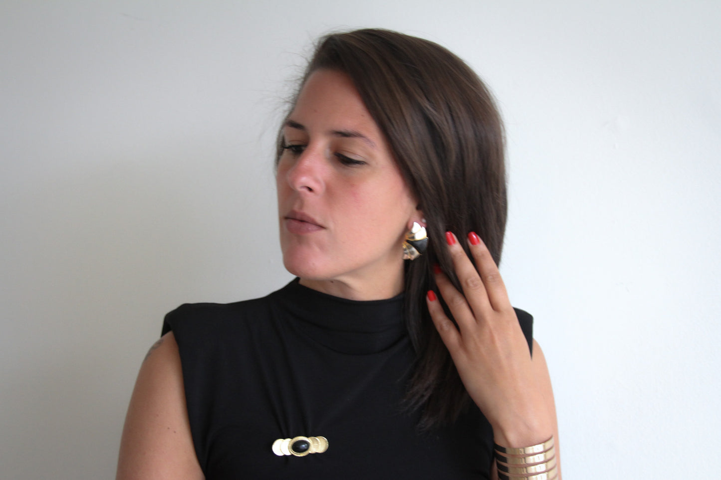 Aiwan Golden Orbit Brooch with Black Stone Center