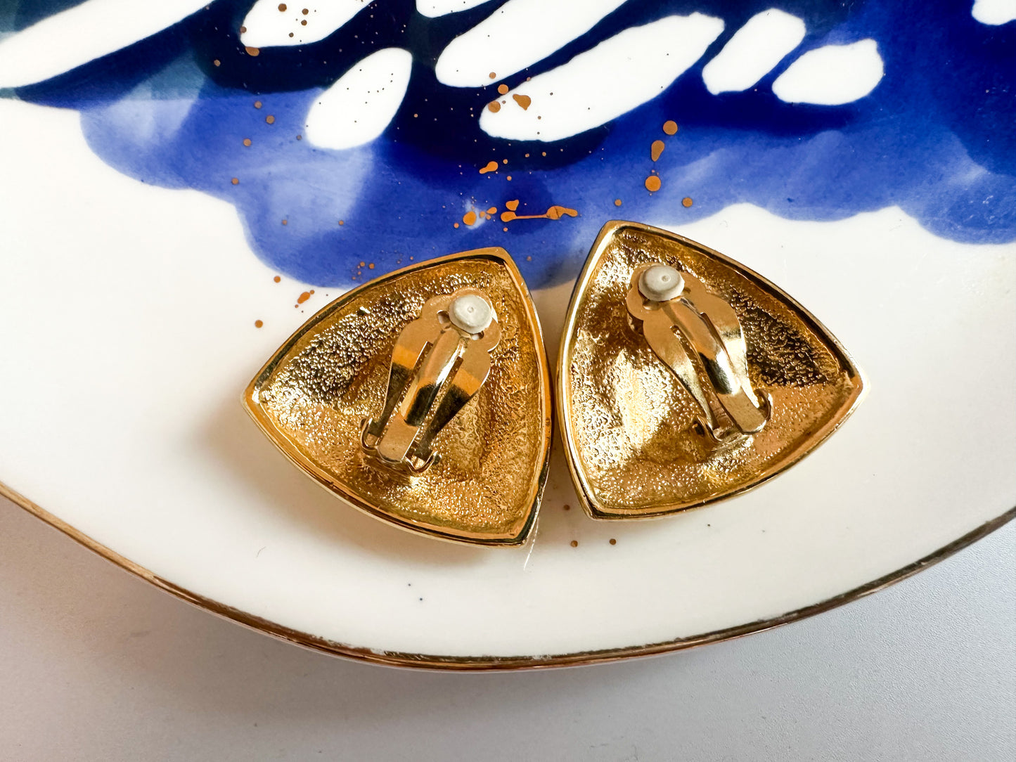 Bold 1980s Triangle Clip-On Earrings with Red Lucite Center