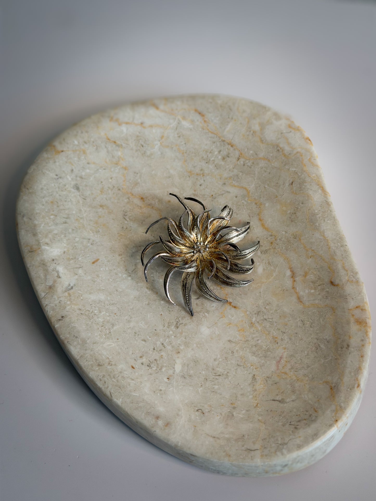 Silver-Tone Sculptural Sunburst Brooch
